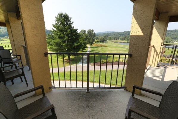 Private balcony with outdoor seating and beautiful views, perfect for enjoying the fresh air.