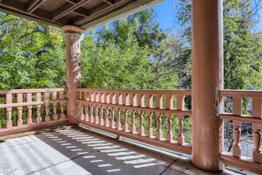 Trees surround the spacious patio area making for a more private and enjoyable experience
