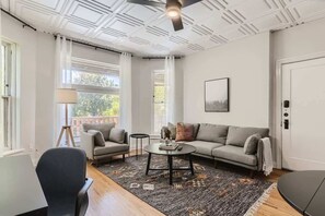 High ceilings and large windows make this space feel roomy and light