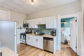 The kitchen comes equipped with all the essentials you need to prep meals from home