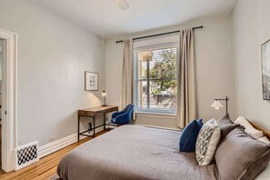 Comfortable queen sized bed and in room desk for working remotely