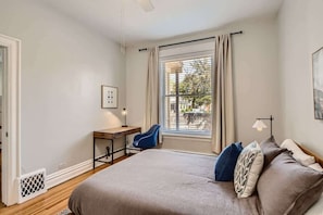 Comfortable queen sized bed and in room desk for working remotely