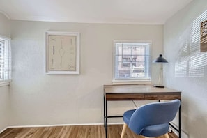 Two windows bring light and airiness to the work from home room