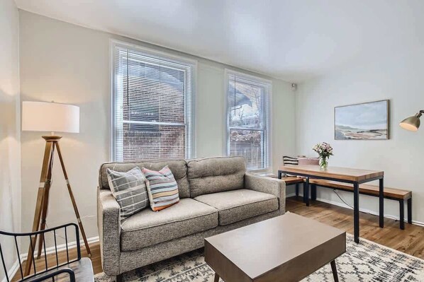 Bright and stylish living area with banquet bench at the dining table