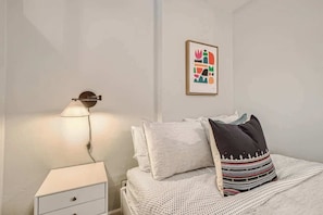 The bed comes furnished with all the bedding pictured