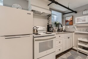 The kitchen comes equipped with all the essentials you need to prep meals from home