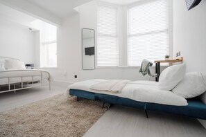 Room Features:

-1 x Double Bed
-1 x Sofa Bed
-Plugs in bedside table (direct USB plug available)
-Dedicated workspace
-Smart TV with Netflix
-Private mini fridge with freezer
-Open space with hangers for hanging clothes