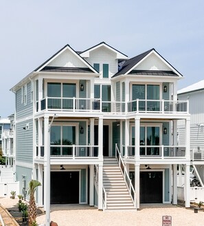 Brand new luxury 3 story home with elevator, pool, hot tub and putting greens