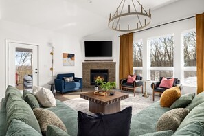 Create lasting memories in this stunning living room where comfort meets elegance. The fireplace crackles, stories unfold, and laughter fills the air.