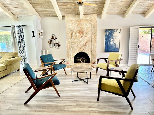 Wonderful living room with cathedral ceiling and gas marble fireplace.