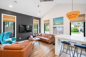 Open concept kitchen, dining and living space