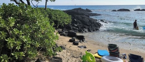 Turtle Beach, right across the street. You will traverse over rocks to the north and you will find Turtle Beach which is a secret beach in Kona.