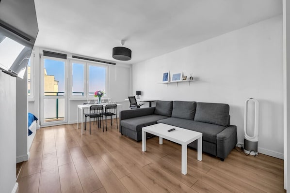 Studio - Living area with Queen Bed and Full Sofa Bed | Book Now with RENTUJEMY.COM