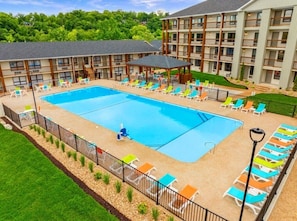 Olympic size swimming pool with an handicapped-accessible chair.