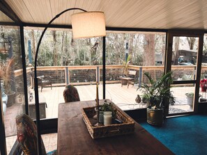 Enjoy the large screened in porch attached to brand new deck.