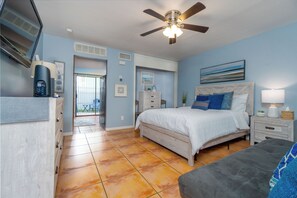 Experience comfort in our cozy bedroom featuring a plush bed and a refreshing ceiling fan. Perfect for restful nights, this inviting space is ideal for your stay. Enjoy quality linens, stylish decor, and all the essentials to make you feel at home!