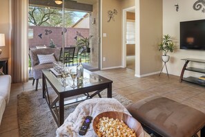 Cozy living room space that leads out to the backyard patio. 