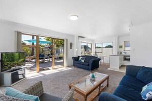 Sunny living area opening to deck