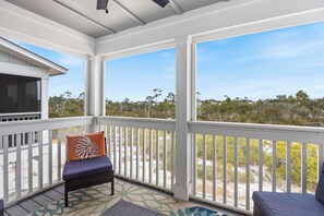 Hummingbird Hideaway - 14306 Beach Heather at Lost Key - Private screened balcony is a perfect spot to watch for the Blue Angels on a practice day.