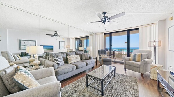 Step into this bright and beachy living room, where floor-to-ceiling views of the Gulf set the tone for a relaxing coastal stay. Sink into plush seating, enjoy the ocean breeze from the balcony, and make yourself at home.