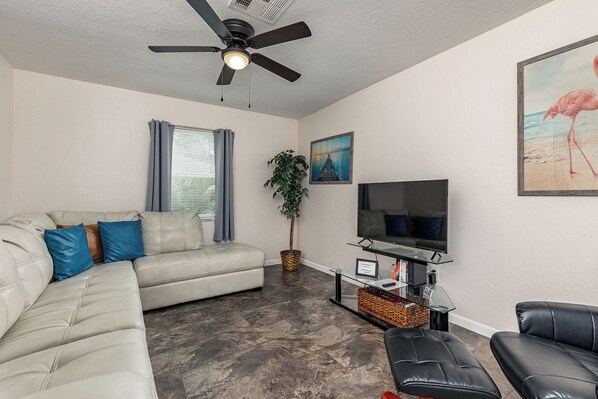 This private living room comes with strong wifi, a Roku TV, and a comfy couch!