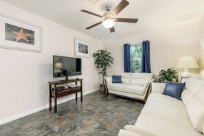 This private living room includes a TV and multiple comfy couches!