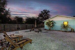 We have a grill and an abundance of beachy furniture for you to relax on!