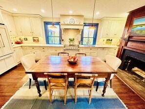 Gourmet kitchen features an AGA induction range and other high-end appliances.
