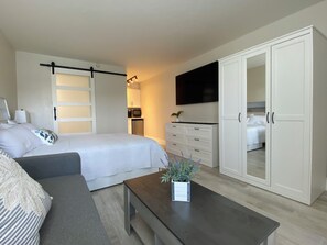 View of barn door and kitchenette