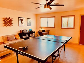 Rec Room / Bedroom with ping pong table, office space, gym and two twin beds