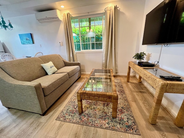 Living area with couch and Smart TV
