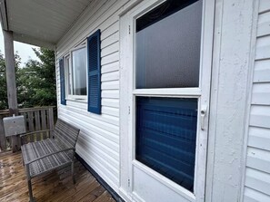 Freshly painted door and shutters and a new bench to enjoy the view. 
