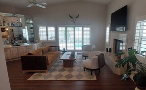 Living Room with Fireplace, Big Screen HDTV plus Bar