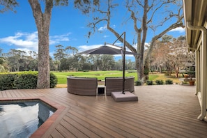 Golf Views: Enjoy serene tee views from the comfort of your poolside deck.