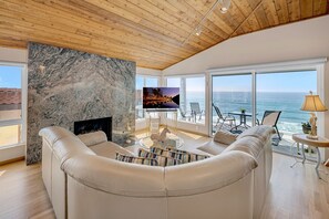 Living room with stunning ocean views and a smart TV. The fireplace is not for use.