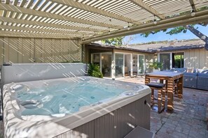 Soak, sip, and unwind in your private hot tub under a stylish & lit pergola—perfect for relaxing after a day of adventure.