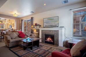 Warm gas fireplace, comfy seating, and smart TV for movie nights