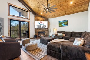 Living Area with Cable TV, Fire Place, and Deck Access