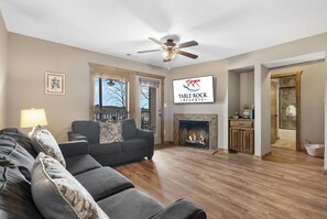 Living Area with Sleeper Sofa, Fireplace, Cable TV, and Deck Access