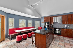 Fully equipped kitchen and dining area with plenty of seating available!