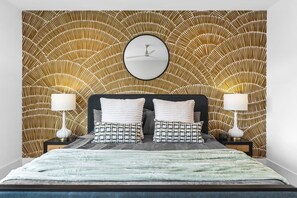 Bedroom #5 on the top floor with a King bed, Twin bed, Smart TV, large ensuite bathroom, and huge walk-in closet.