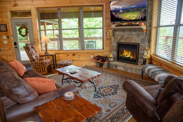 Open living area with leather seating and Smart TV