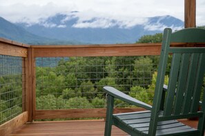 Wrap around deck with stunning view, hot tub, and outdoor seating 