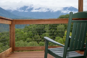 Wrap around deck with stunning view, hot tub, and outdoor seating