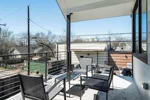 Outdoor patio balcony with full dining area