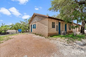 Leaf your worries behind in this shady bungalow under live oaks