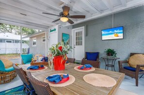 Screened lanai off the kitchen. Enjoy meals in the great outdoors without all the critters!