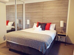 Enjoy restful nights on a queen-sized bed adorned with professionally laundered linen, ensuring a fresh and inviting sleeping experience that feels like a luxury retreat.