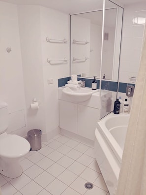 This fully equipped bathroom offers modern fixtures, a spacious layout, and everything you need for a comfortable stay. Whether preparing for the day or unwinding in the evening, this space has it all.
