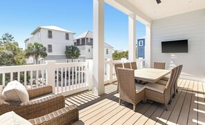 2nd Floor Balcony with outdoor dining and TV